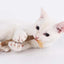 cat chewing on catnip stick